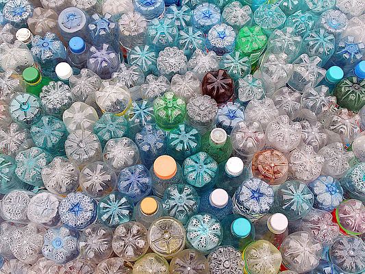 Dirty used colored plastic bottle pile ready to be recycled (©sebasnoo/shutterstock)